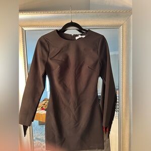 Brand :Likely Size 2 black sheath style with fringed sleeves